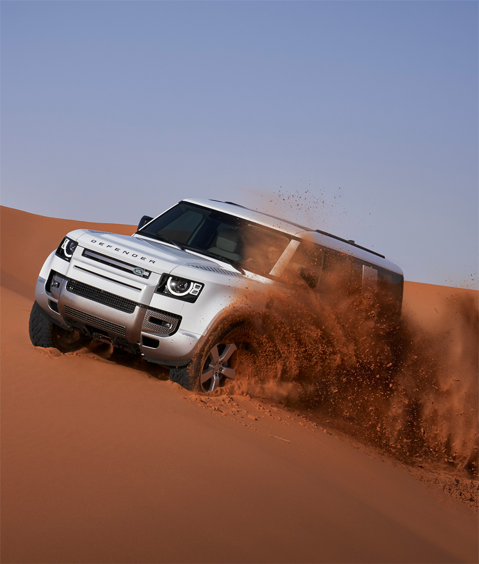 Land Rover driving through dirt