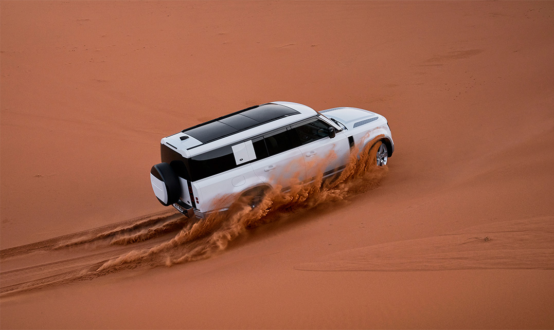 Land Rover driving through the desert