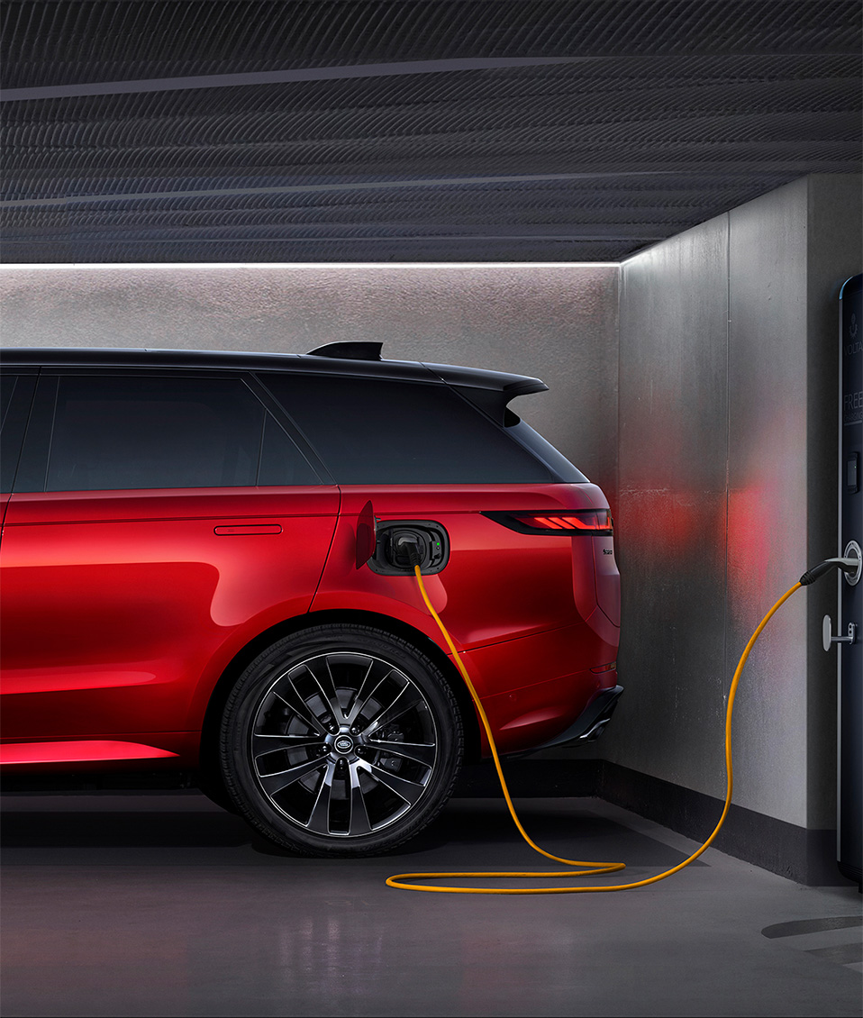 EV Land Rover charging in garage